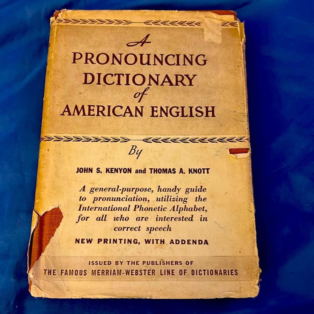 A Pronouncing Dictionary 
of the English
A hardcover brown book
Used
